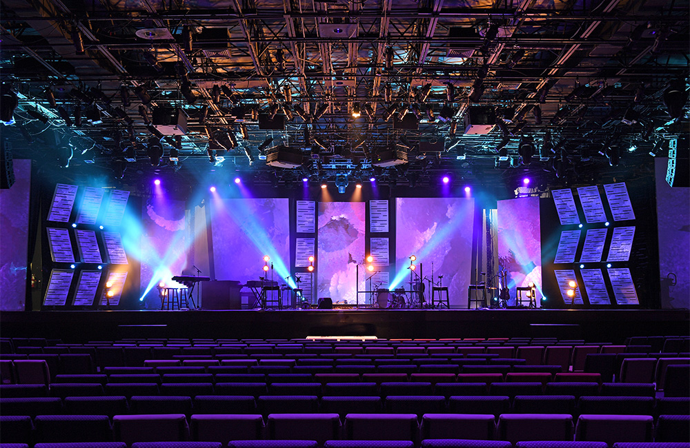 photo of stage with blue and purple lights for a blog discussing attendee engagement strategies